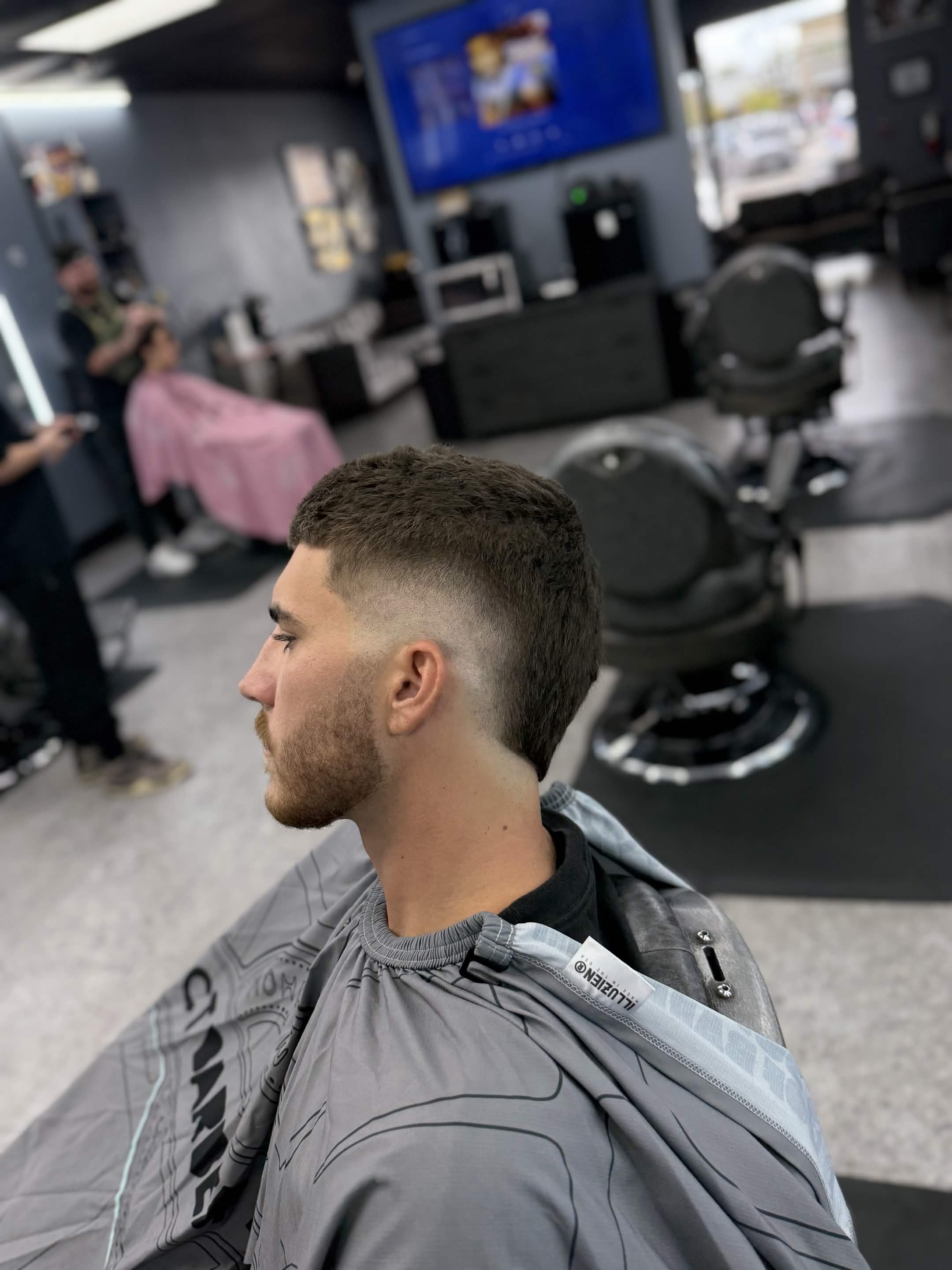 Clean side fade and beard detail by Lenny