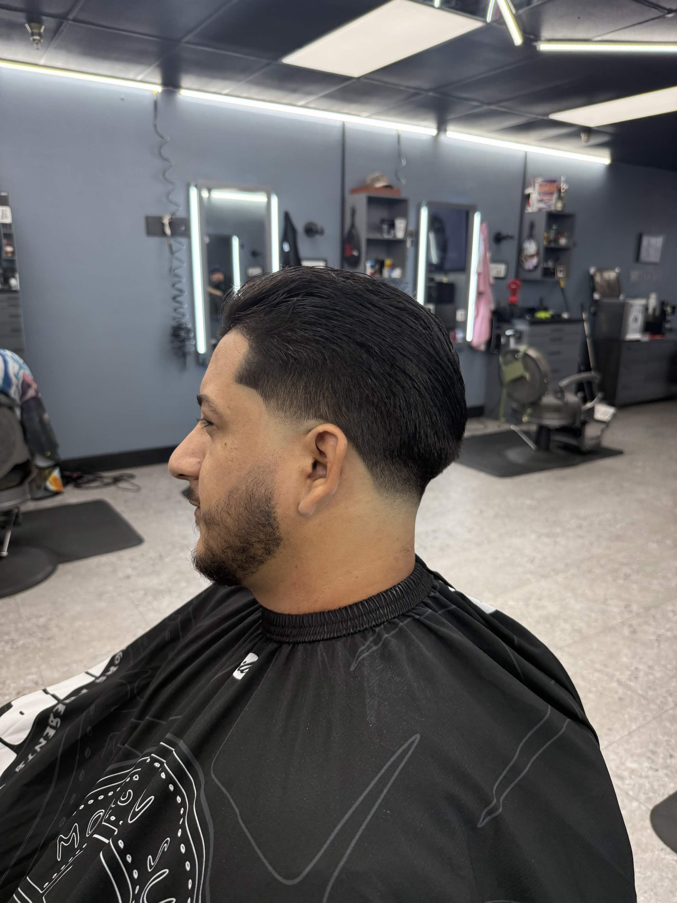 Polished side haircut and beard blend by Lenny